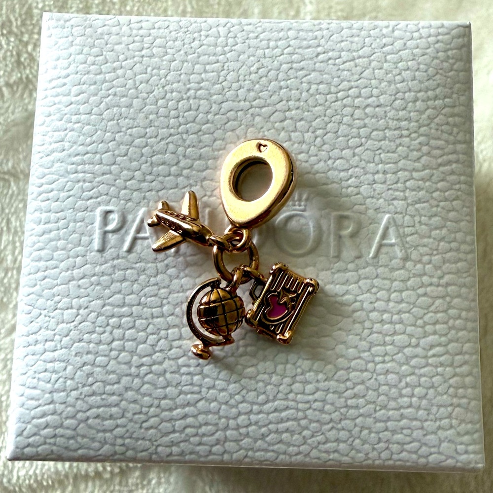 Pandora Rose gold airplane, globe, & suitcase bracelet charm